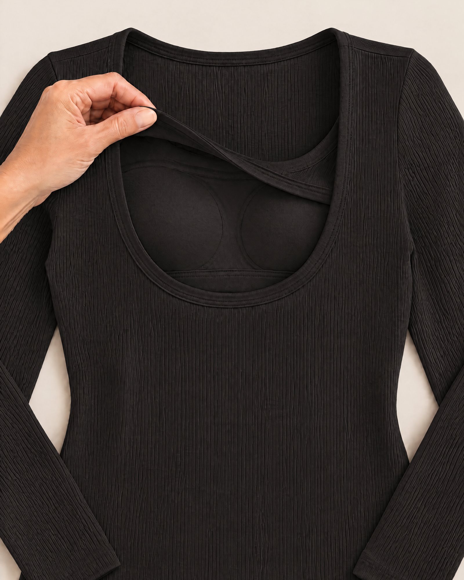 Inside the Ribbed Long-Sleeve Top, Black: the inner layer and a padded cup